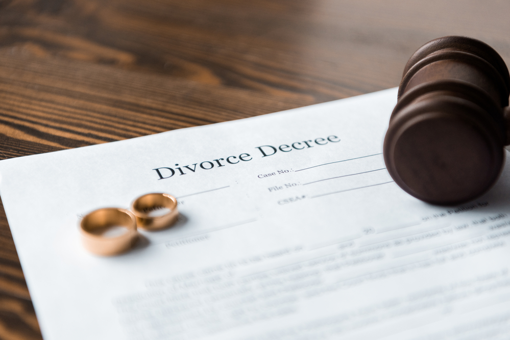 Family Lawyer - rings on divorce decree with gavel